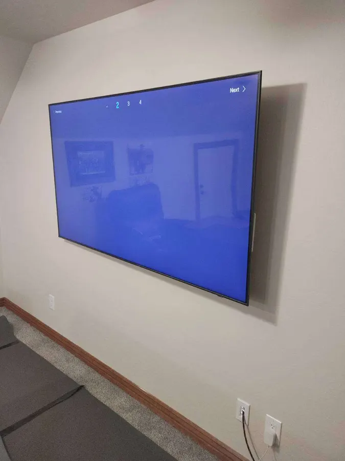 Large TV wall mount in a living room, White Mountains, AZ