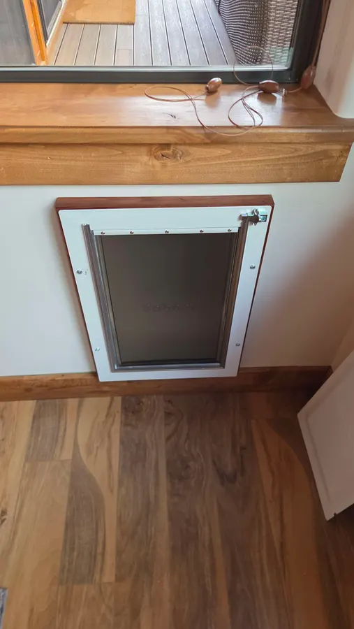 Pet door installed in a wall with the electrical moved, White Mountains, AZ
